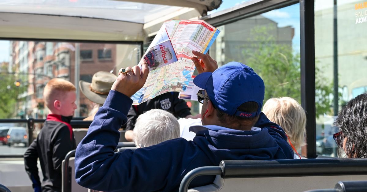 tourists explore valencia on an open top bus tour highlighti